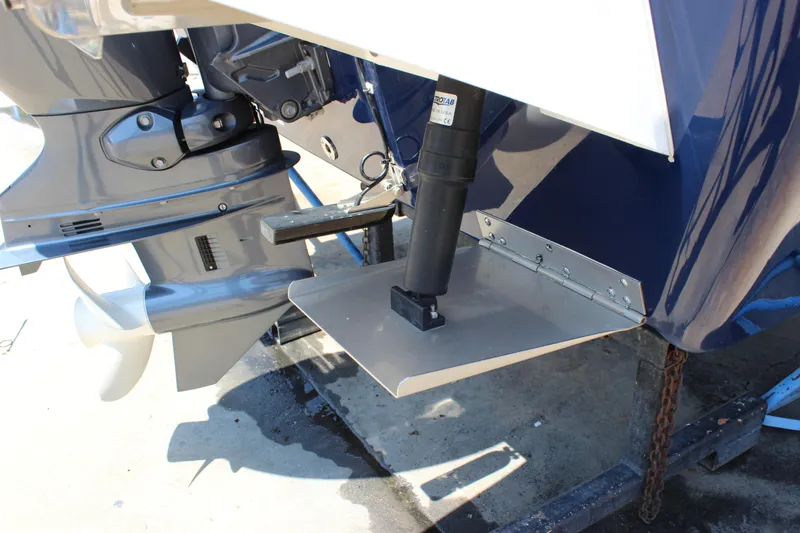 Slide: The Image of 2023 C-Dory 22' Cruiser boat motor and trim tab detail. - 9