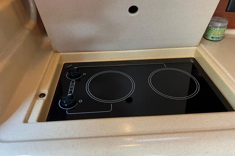 Slide: The Image of Stovetop in 2003 Sea Ray 320 Sundancer yacht kitchen area. - 20