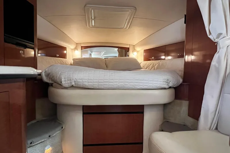 Slide: The Image of Luxurious cabin interior of 2003 Sea Ray 320 Sundancer yacht with cozy bed. - 34