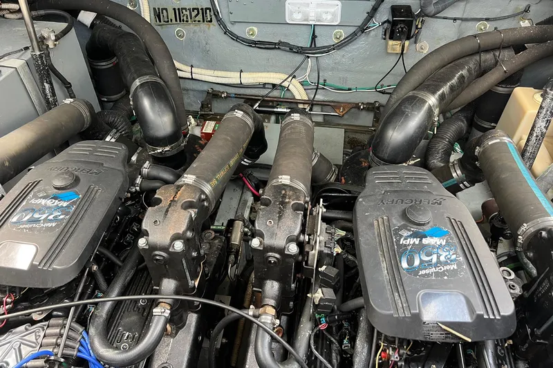 Slide: The Image of Engine compartment of a 2003 Sea Ray 320 Sundancer with twin MerCruiser 350 engines. - 38