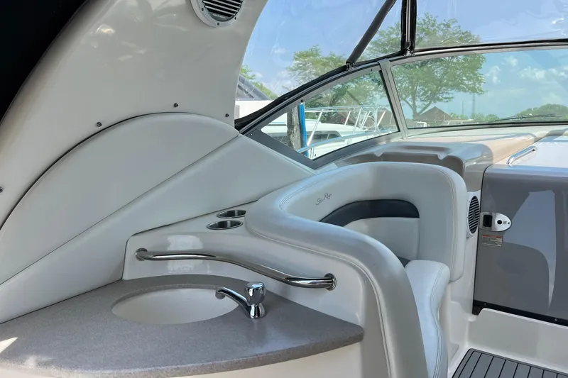 Slide: The Image of Interior of 2003 Sea Ray 320 Sundancer boat with sink and seating area. - 5