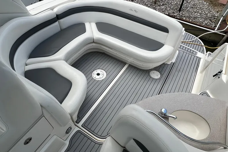 Slide: The Image of Luxurious seating area on a 2003 Sea Ray 320 Sundancer boat. - 6