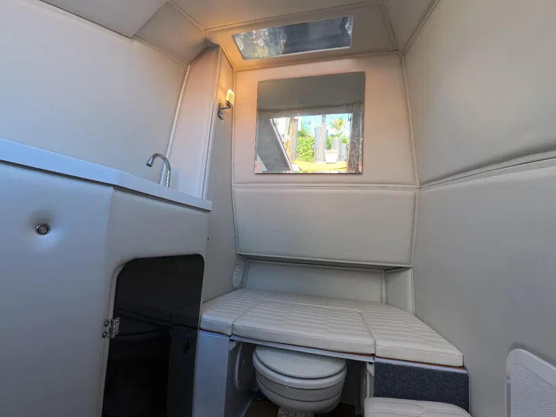 Slide: The Image of Compact bathroom interior of Novielli Veloche 349 yacht, featuring sink and toilet, 2026 model. - 14