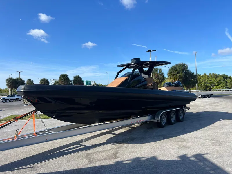 Slide: The Image of 2026 Novielli Veloche 349 boat on trailer under clear blue sky. - 2