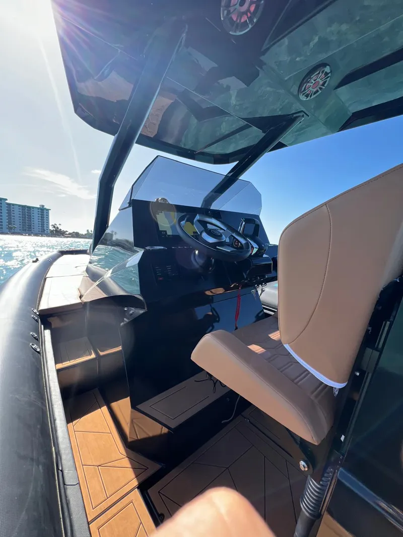 Slide: The Image of Interior of 2026 Novielli Veloche 349 boat with steering wheel and seating. - 3