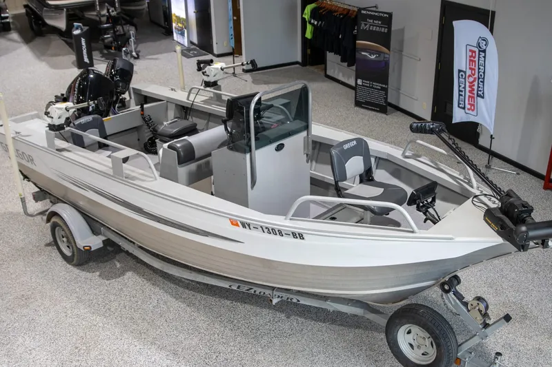 Slide: The Image of 2018 Gregor Eagle 20 boat on trailer in showroom, featuring modern design and equipment. - 4