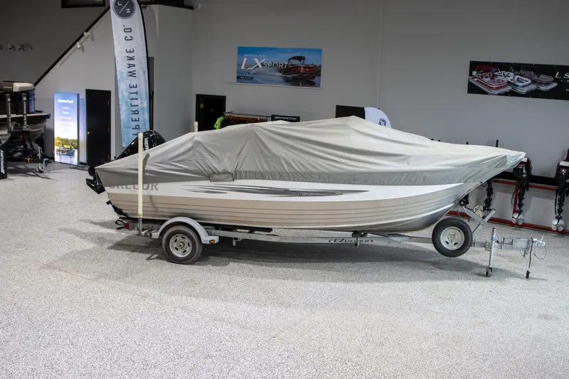 Slide: The Image of Covered 2018 Gregor Eagle 20 boat on trailer in showroom. - 6