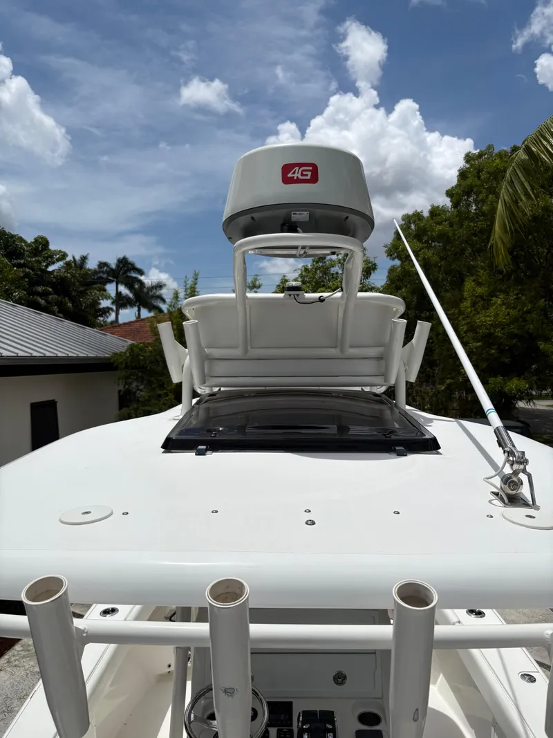Slide: The Image of Young 27 boat with radar and antenna under a clear blue sky, 2019 model. - 15