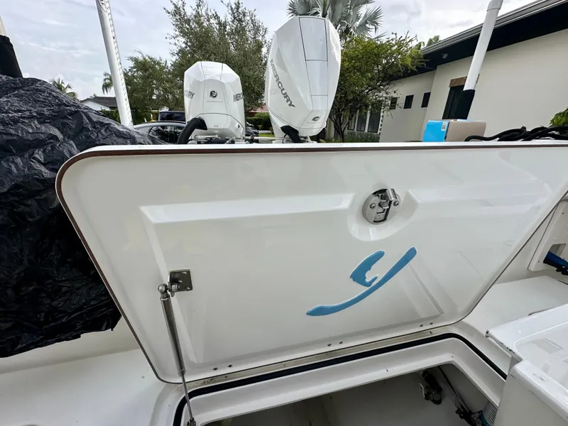 Slide: The Image of Boat storage compartment with Mercury outboard motors, Young 27 model, 2019. - 29