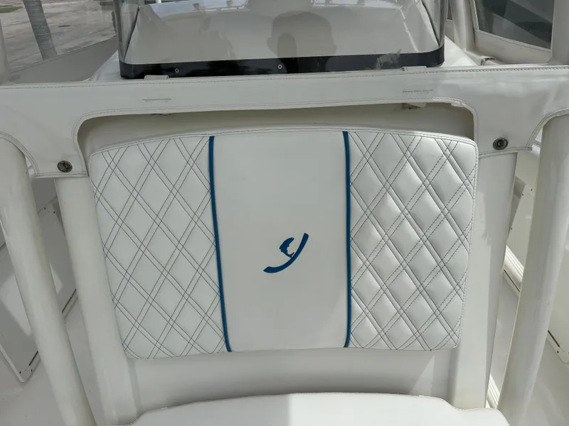 Slide: The Image of White quilted boat seat with blue accent, Young 27 model, 2019. - 32