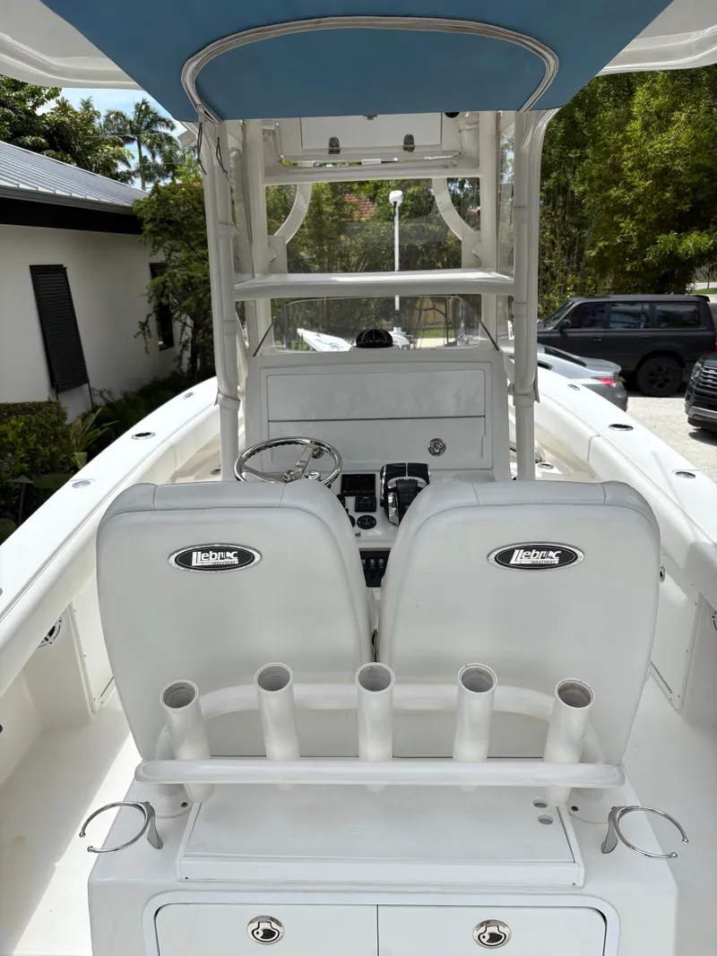 Slide: The Image of Center console of a 2019 Young 27 boat with dual seats and rod holders. - 5