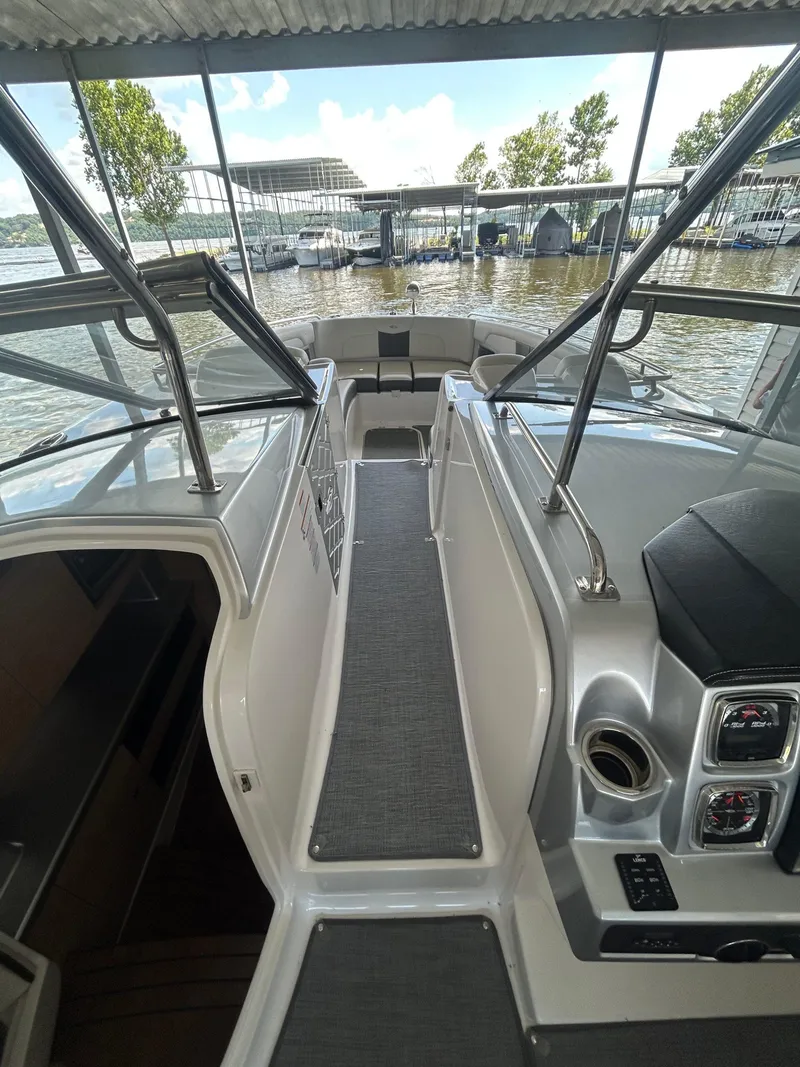 Slide: The Image of 2014 Chaparral 327 SSX boat interior with sleek design and modern controls. - 12