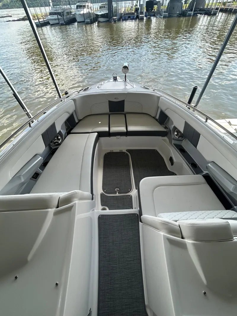 Slide: The Image of 2014 Chaparral 327 SSX boat interior with spacious seating and water view. - 14