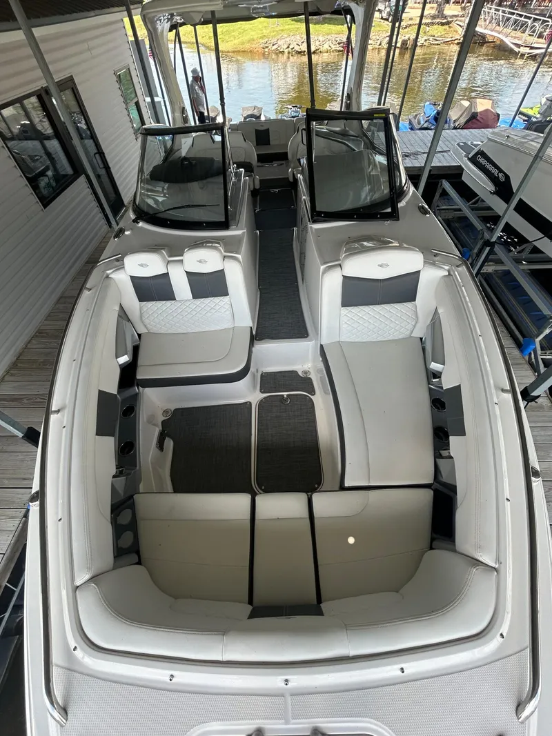 Slide: The Image of 2014 Chaparral 327 SSX boat interior with spacious seating and modern design. - 15