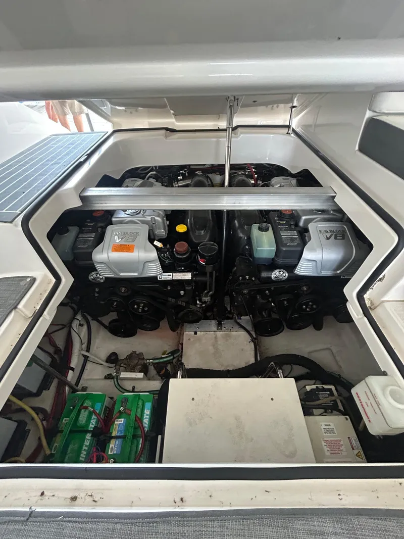 Slide: The Image of Engine compartment of a 2014 Chaparral 327 SSX boat, featuring dual V8 engines. - 20
