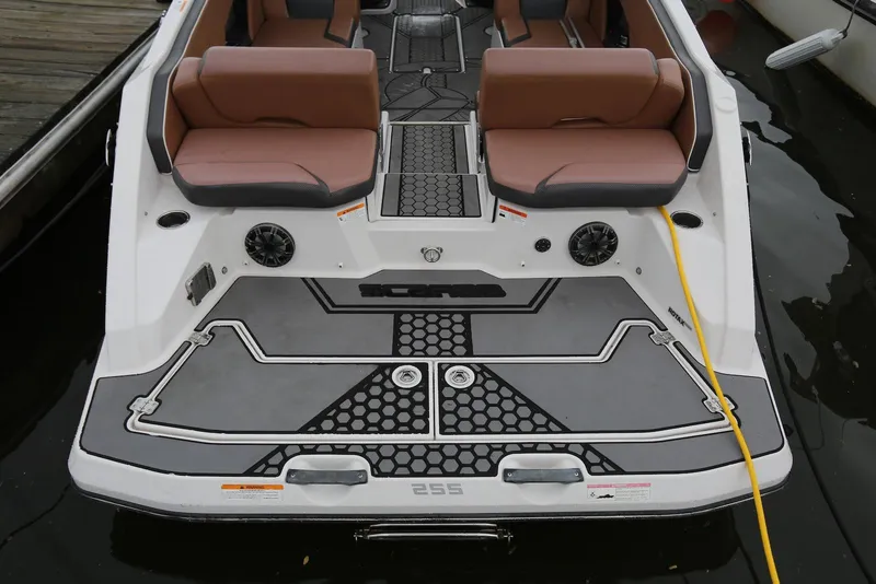 Slide: The Image of 2017 Scarab 255 Impulse boat with brown seating and modern deck design. - 12