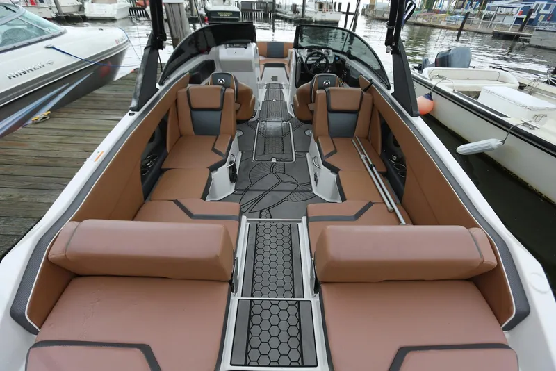 Slide: The Image of 2017 Scarab 255 Impulse boat interior with brown seating and modern design. - 18