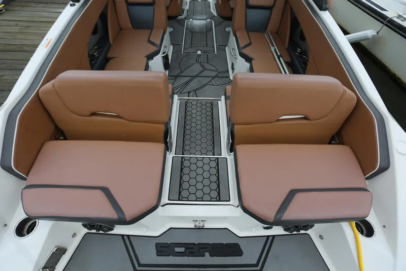 Slide: The Image of 2017 Scarab 255 Impulse boat interior with tan seating and hexagonal floor design. - 19