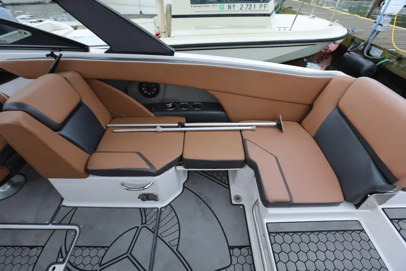 Slide: The Image of 2017 Scarab 255 Impulse boat interior with tan and black seating. - 26