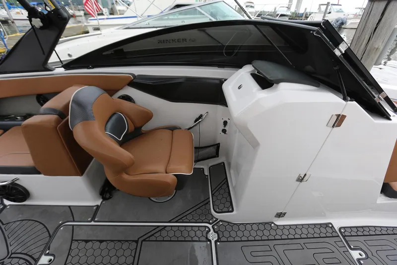 Slide: The Image of 2017 Scarab 255 Impulse boat interior with brown seating and modern dashboard. - 30
