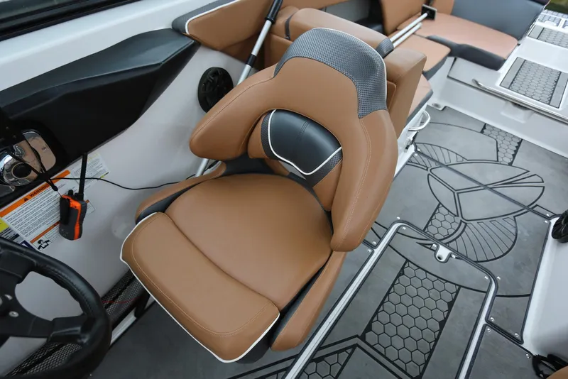 Slide: The Image of 2017 Scarab 255 Impulse boat interior with brown leather seating and modern design. - 32