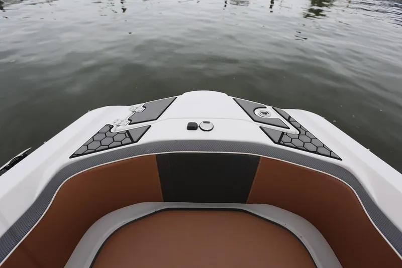 Slide: The Image of Bow of 2017 Scarab 255 Impulse boat with sleek design on calm water. - 38
