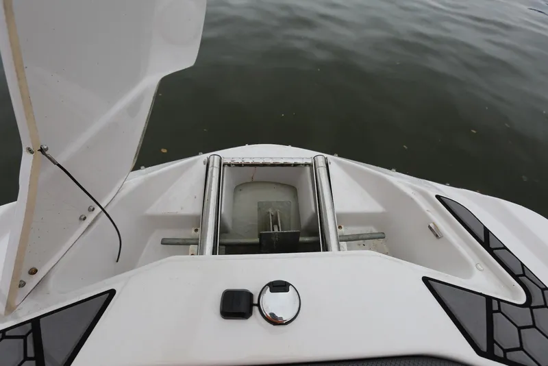 Slide: The Image of 2017 Scarab 255 Impulse boat anchor compartment, open hatch, and water view. - 39