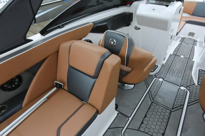 Slide: The Image of 2017 Scarab 255 Impulse boat interior with tan and gray seating, stylish flooring. - 41
