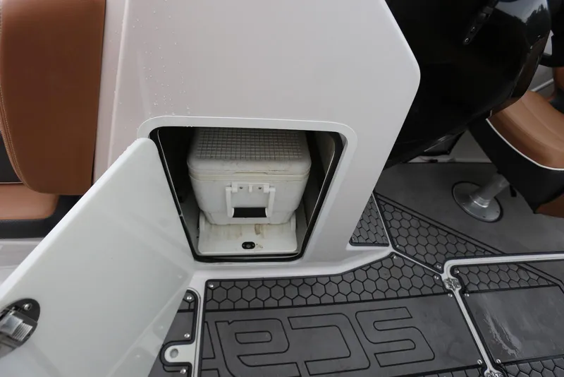 Slide: The Image of Storage compartment with cooler on 2017 Scarab 255 Impulse boat interior. - 44