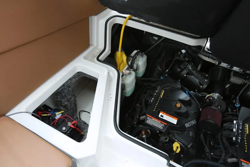 Slide: The Image of Engine compartment of a 2017 Scarab 255 Impulse boat, featuring a Rotax engine. - 48