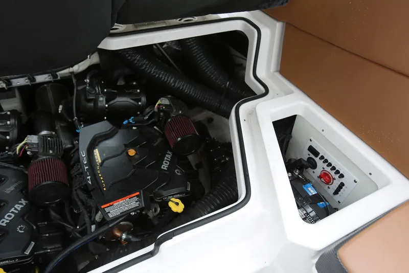 Slide: The Image of Engine compartment of a 2017 Scarab 255 Impulse boat, featuring Rotax engines. - 49