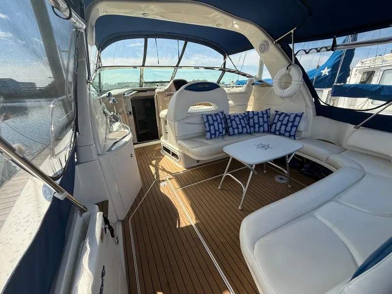 Slide: The Image of Luxurious 2003 Sea Ray 380 Sundancer yacht interior with elegant seating and nautical decor. - 12