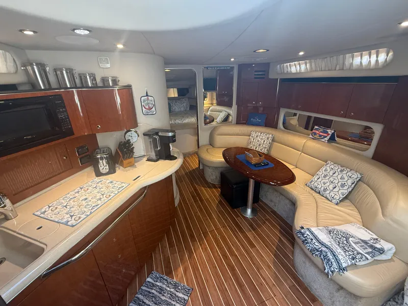 Slide: The Image of Luxurious interior of 2003 Sea Ray 380 Sundancer yacht with kitchen and seating area. - 18