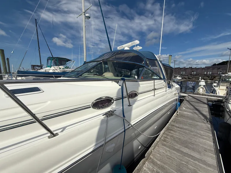 Slide: The Image of 2003 Sea Ray 380 Sundancer yacht docked at marina under blue sky. - 7