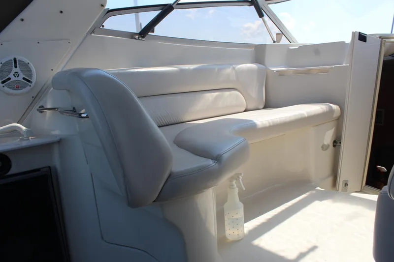 Slide: The Image of 2000 Regal Commodore 2760 boat interior with white leather seating and speaker. - 10