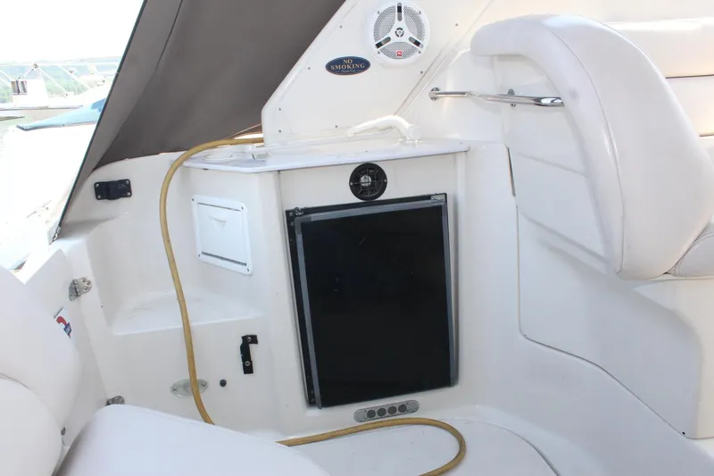 Slide: The Image of Interior of 2000 Regal Commodore 2760 boat with seating and mini fridge. - 11