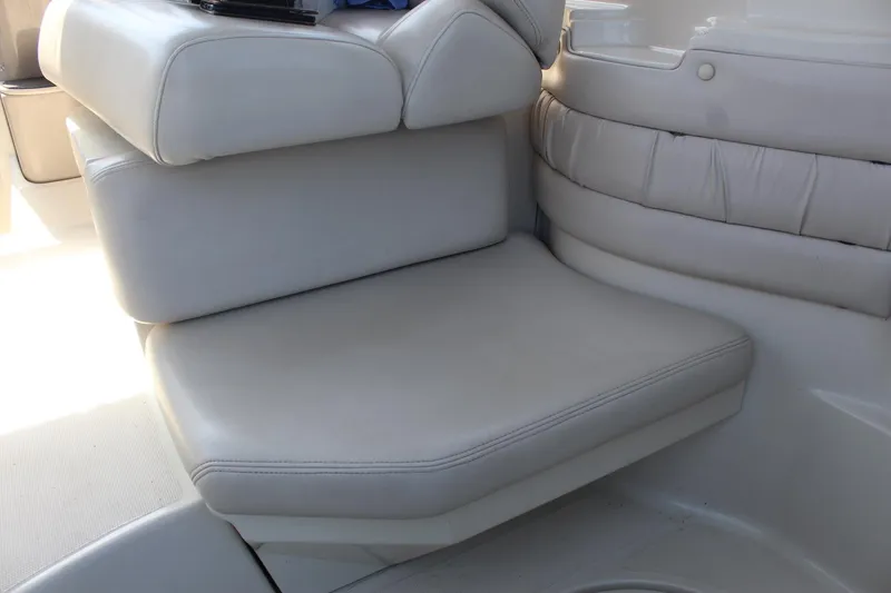 Slide: The Image of 2000 Regal Commodore 2760 boat interior with white leather seating. - 12