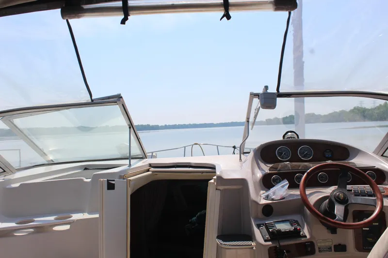 Slide: The Image of Interior view of 2000 Regal Commodore 2760 boat cockpit with steering wheel and dashboard. - 13