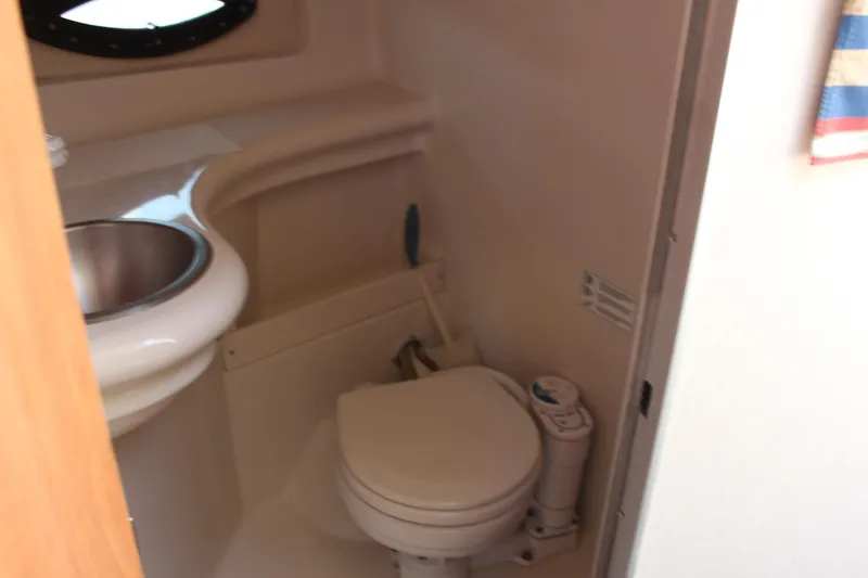 Slide: The Image of 2000 Regal Commodore 2760 boat bathroom with sink and toilet. - 22
