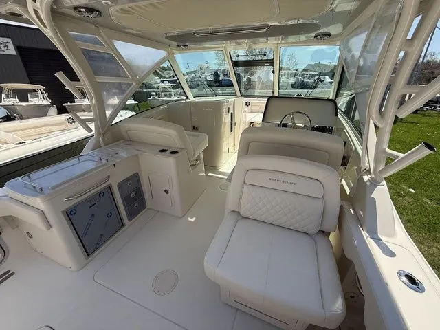 Slide: The Image of 2025 Grady-White Freedom 325 boat interior with luxurious seating and modern controls. - 10