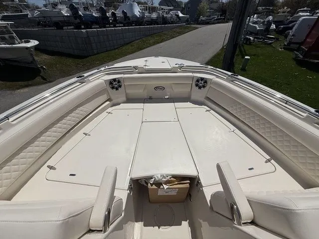 Slide: The Image of 2025 Grady-White Freedom 325 boat interior with spacious seating and modern design. - 15