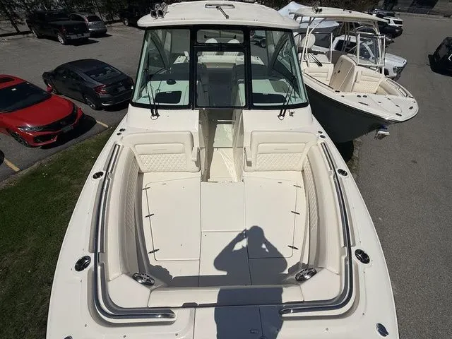 Slide: The Image of 2025 Grady-White Freedom 325 boat with spacious seating and sleek design. - 17