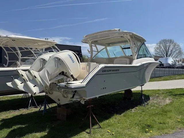 Slide: The Image of 2025 Grady-White Freedom 325 boat with Yamaha engines on display outdoors. - 4