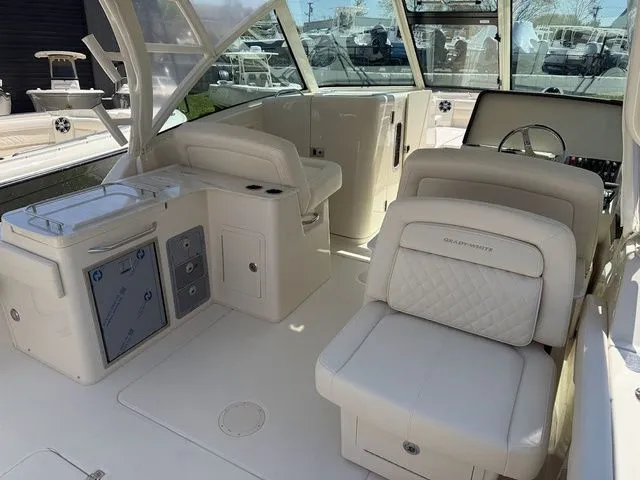 Slide: The Image of 2025 Grady-White Freedom 325 boat interior with luxurious seating and modern helm. - 7