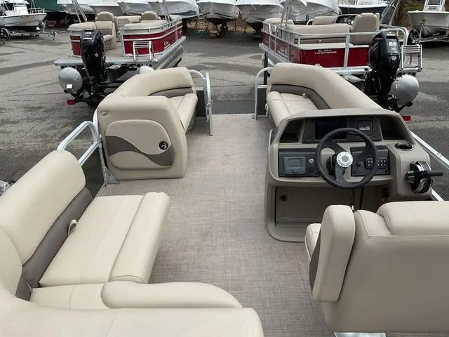 Slide: The Image of 2025 Sun Tracker PARTY BARGE® 18 DLX pontoon boat with spacious seating and modern dashboard. - 6