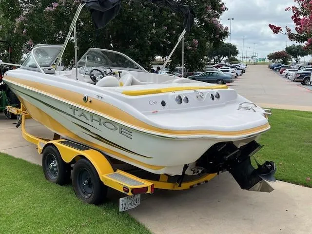 Slide: The Image of 2008 Tahoe Q6SF I/O boat on trailer, parked on grass near parking lot. - 4