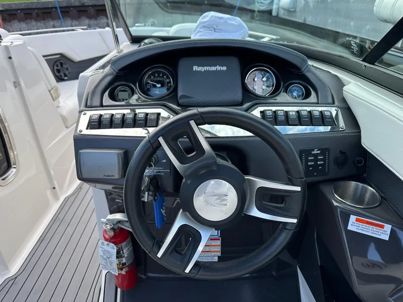 Slide: The Image of Dashboard of a 2014 Monterey 268 Super Sport boat with steering wheel and controls. - 12