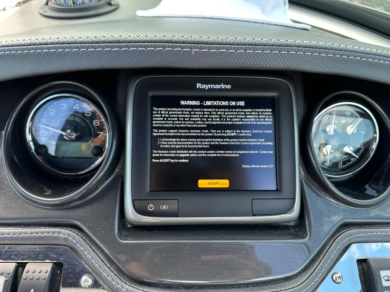 Slide: The Image of Dashboard of a 2014 Monterey 268 Super Sport with Raymarine display and gauges. - 13