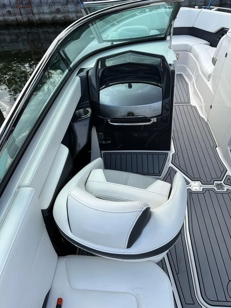 Slide: The Image of 2014 Monterey 268 Super Sport boat interior with white seating and sleek design. - 16