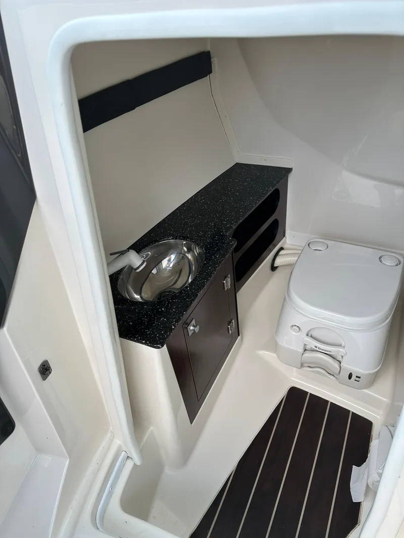 Slide: The Image of 2014 Monterey 268 Super Sport boat interior with sink and toilet. - 18
